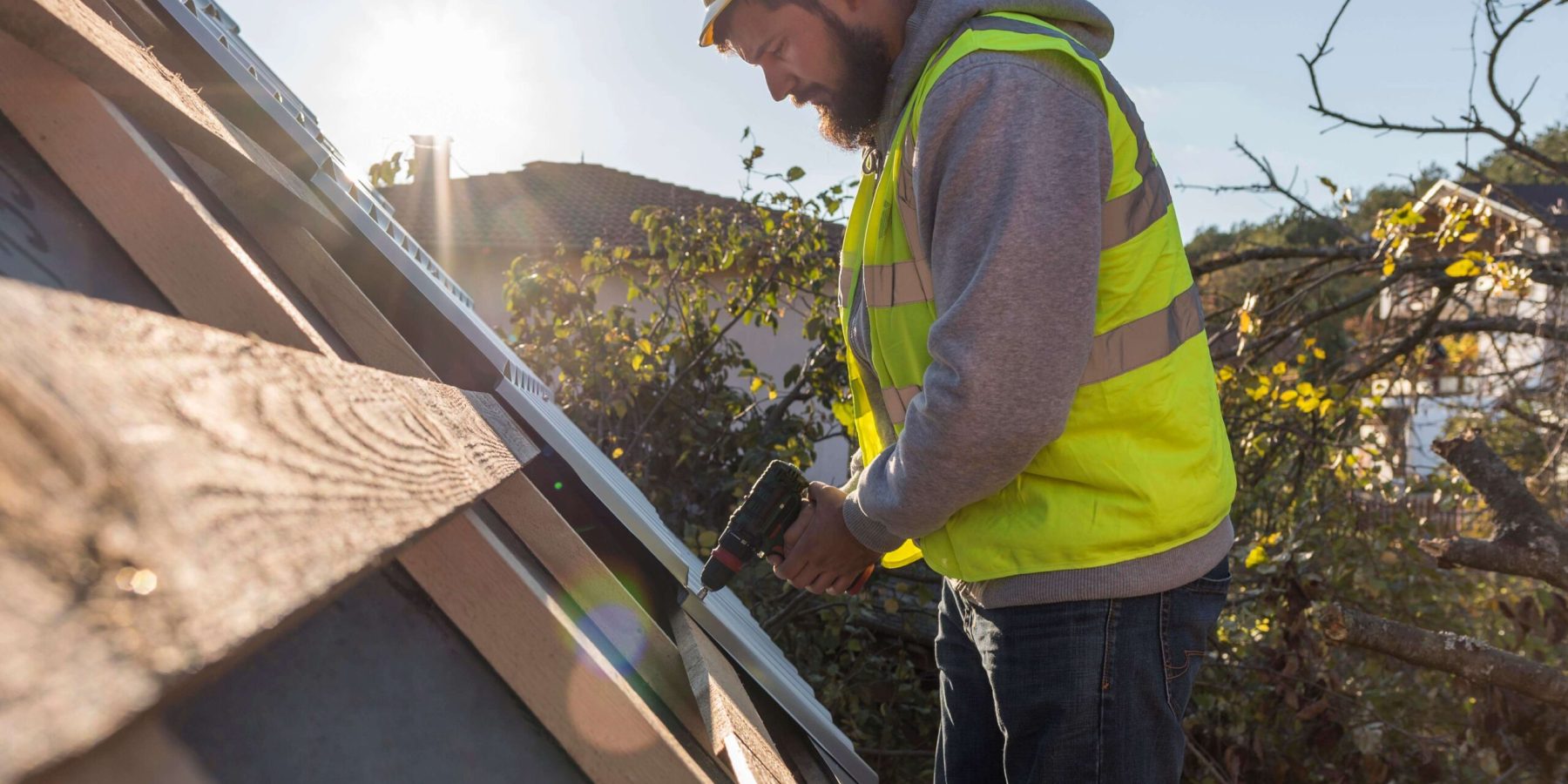 man-working-roof-with-drill